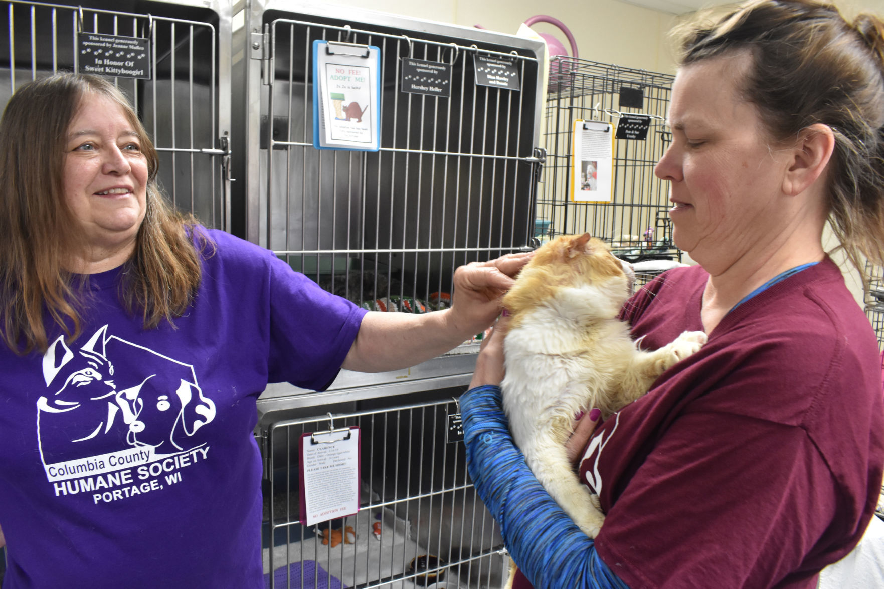 Humane Society board members with Clarence the cat